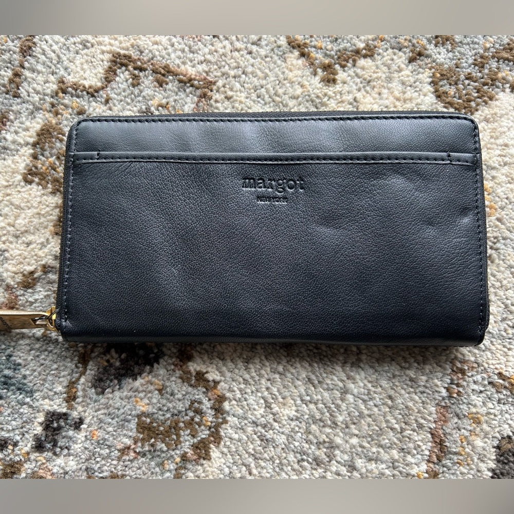 Margot Black Leather Wallet with Gold Zipper. Multiple pockets inside.